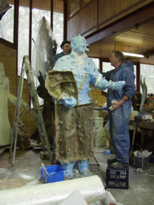 Bonny and Bill helping with fibreglass backing mould for Richie Benaud sculpture