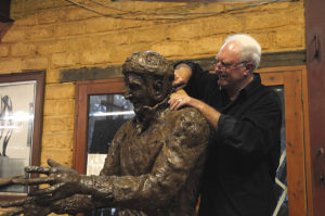 Plowright working on clay model of Trevor Allan sculpture